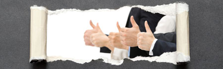 thumbs up behind torn paper