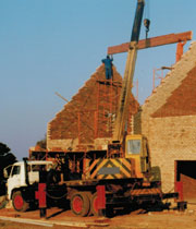 roof beams being crane lifted