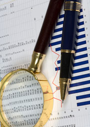 magnifying glass and pen