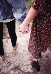 teen boy and girl holding hands