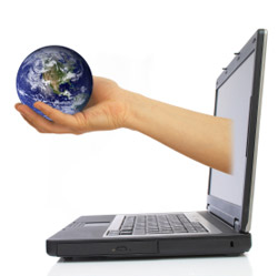 laptop with hand and globe